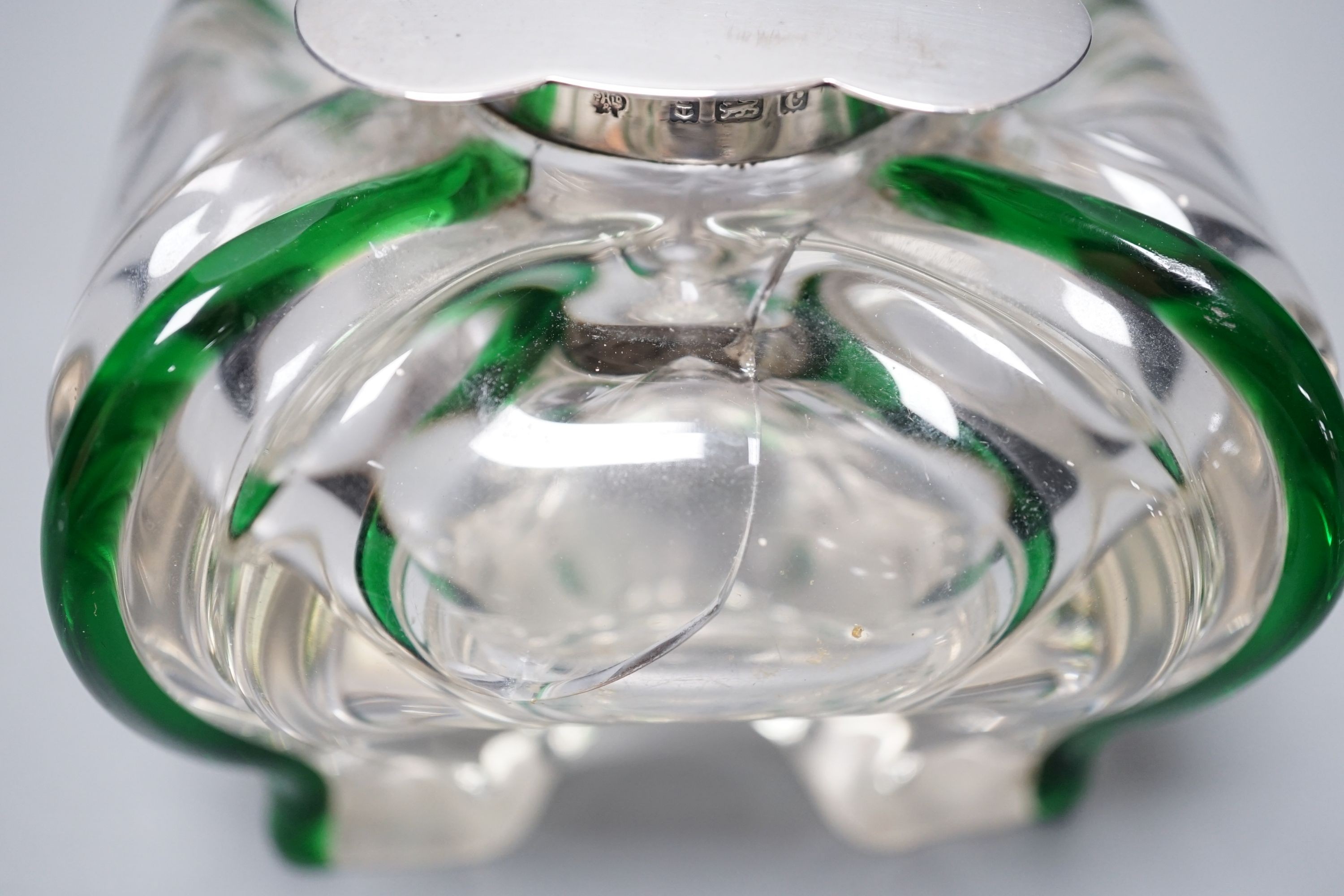 A silver-mounted green trailed glass inkwell, possibly Powell, Whitefriars. The lid initialled ‘G.B.H’ Height - 8cm